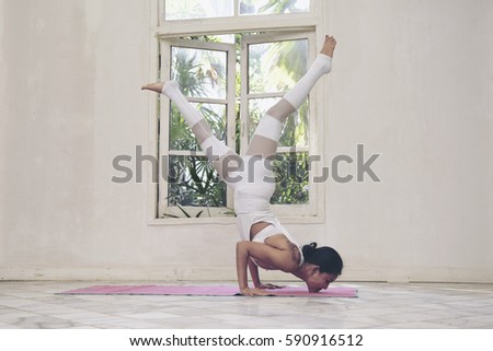 Beautiful woman meditates while practicing yoga. Freedom Beauty fitness woman doing exercises at home Concept of healthy lifestyle.Calmness and relax happiness woman. Toned picture