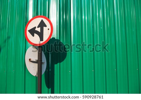 Traffic sign with green corrugated metal texture surface, green zinc wall background