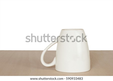 Glass placed on a wooden floor, isolated against a white background.