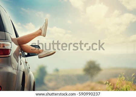 Vintage photo of leg woman in car during morning time holiday