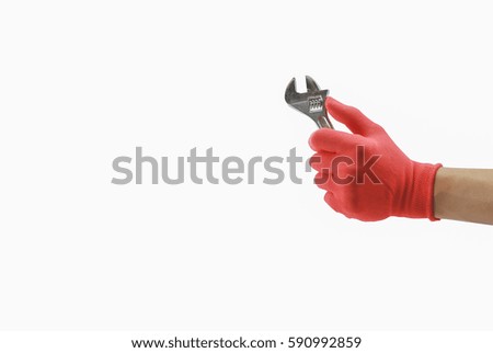 Man's hand in red protective glove holding an adjustable wrench On a white background.isolated.