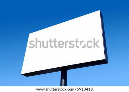 White blank billboard and a blue sky.