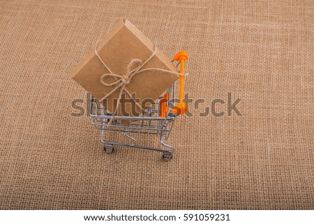 Trolley with a wrapped gift box