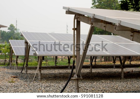 Field Of Solar  Panels  In A Rural Setting  and renewable clean energy.power technology modern industry, university , hospital .