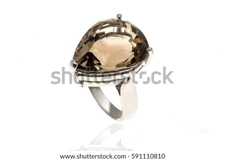 Beautiful ring with big stone on white background