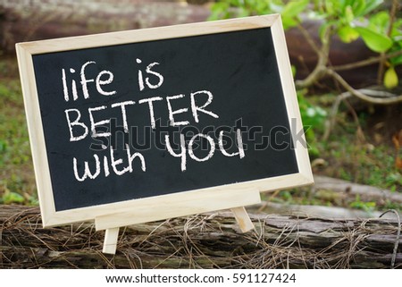 Black board with the motivational phrase, life is better with you