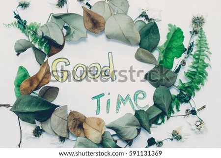 The inscription on the white sheet and leaves of plants flowers
