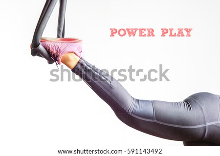 POWER PLAY : Typed words over the athletics women inside the fitness centre with white background. Conceptual image for sports, training, athlete and fitness.