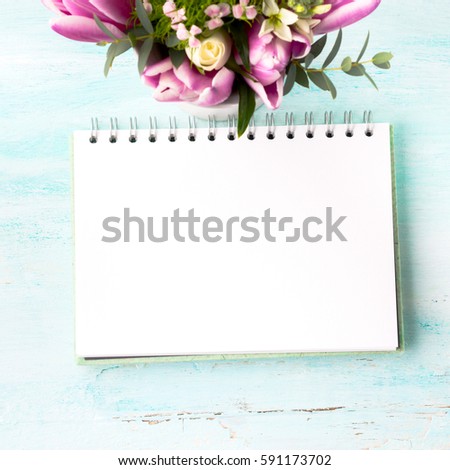 Blank empty notebook page. Spring summer flat lay with colorful roses tulips flowers. Morning wedding planning