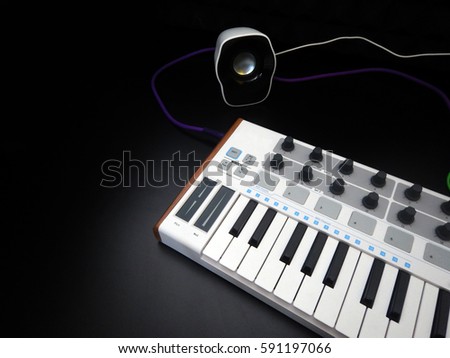 Electronic musical instrument or audio mixer or sound equalizer on a black background (analog modular synthesizer)

