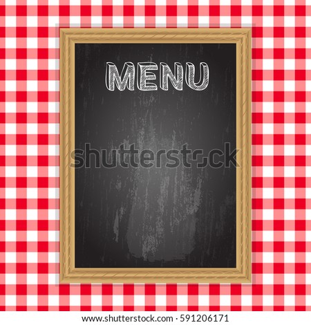 Blackboard with menu word in chalk on table cloth background