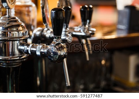Close-up of the beer pipes on bar counter