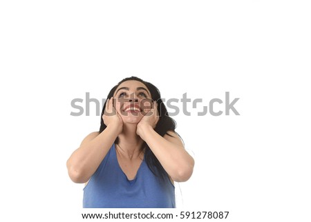 head and shoulders portrait of young beautiful hispanic woman looking up to blank copy space surprised in shock and disbelief  isolated on white background in surprise face expression