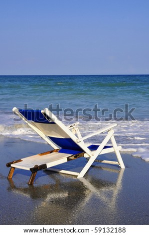 Beach Chair by the sea shore, perfect for cover art