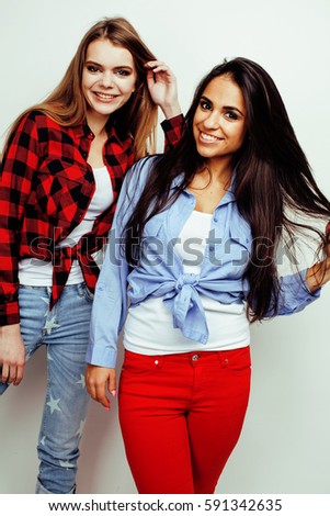 best friends teenage girls together having fun, posing emotional on white background, besties happy smiling, lifestyle people concept, blond and brunette multi nations 