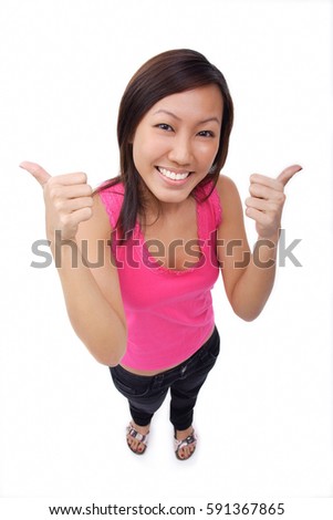 Young woman making thumbs up sign, smiling up at camera