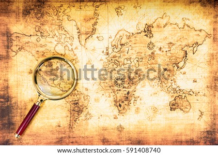 Old map with an magnifying glass explored it. Vintage travel background