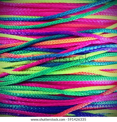rainbow  background with string band green red phosphorescent yellow
