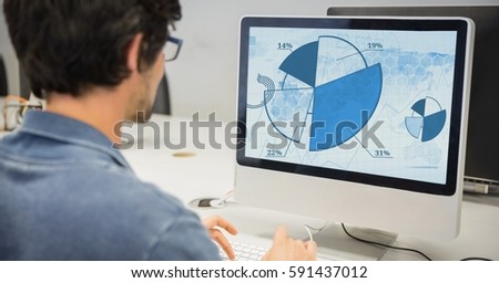 Graphics designer working on computer in office