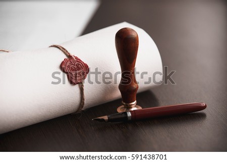 Last Will and testament document with pen and notary seal Royalty-Free Stock Photo #591438701