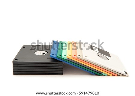 Stack of colorful floppy diskettes isolated on the white background.