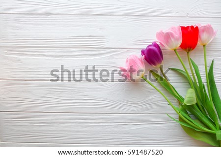Mother's Day,woman's day. tulips  on white wooden background.space for your text Royalty-Free Stock Photo #591487520
