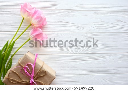 Mother's Day, woman's day. tulips ,presents  on wooden background Royalty-Free Stock Photo #591499220