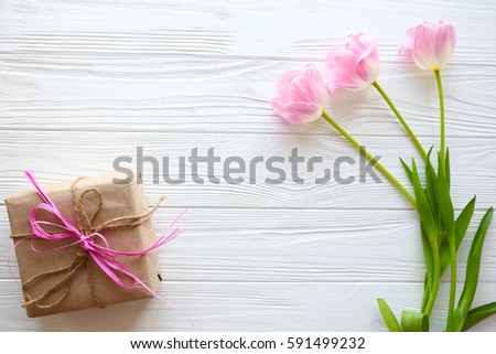 Mother's Day, woman's day. tulips ,presents  on wooden background Royalty-Free Stock Photo #591499232