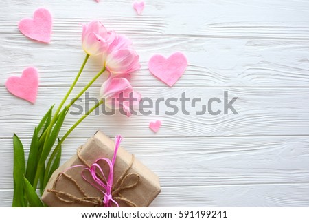 Mother's Day, woman's day. tulips ,presents  on wooden background Royalty-Free Stock Photo #591499241