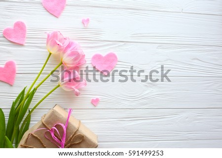 Mother's Day, woman's day. tulips ,presents  on wooden background Royalty-Free Stock Photo #591499253