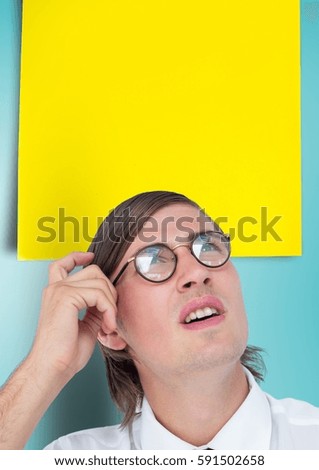 Digital composite image of confused male executive with blank sticky note over head