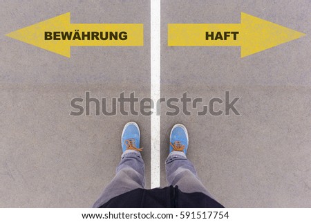Bewaehrung oder Haft (German for probation or jail sentence) direction sign text on asphalt ground, feet and shoes on floor, personal perspective footsie concept