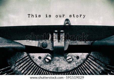 This is our story words typed on a vintage typewriter in black and white. Royalty-Free Stock Photo #591519029