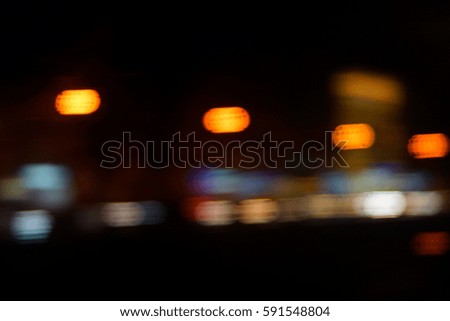 Night city lights blur. Retro toned photo, vintage