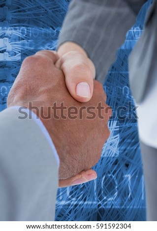 Close-up of businesspeople shaking hands against digitally generated background