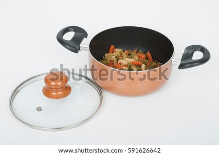 Kitchen pot with glass lid on white background