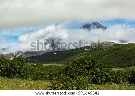Avacha Volcano or Avachinskaya Sopka in the clouds on the Kamchatka Peninsula