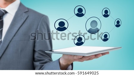 Digital generated image of businessman holding digital tablet with connecting icons