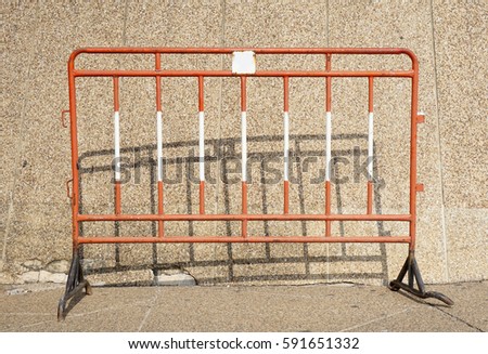 Metal barrier with concrete background 
