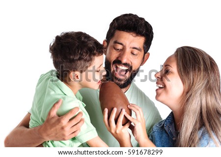 Brazilian family eating chocolate easter egg Royalty-Free Stock Photo #591678299