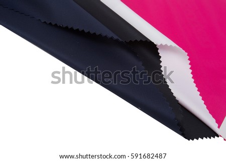Polyester Fabric colorful  on background .Fabric swatch samples on black  background,
Blurry and sofl focus  .out of focus and seletive focus 