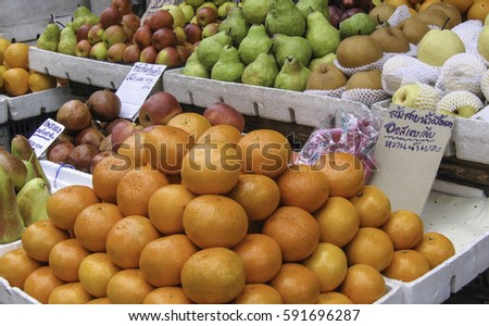 Picture stalls selling fresh fruit, market.