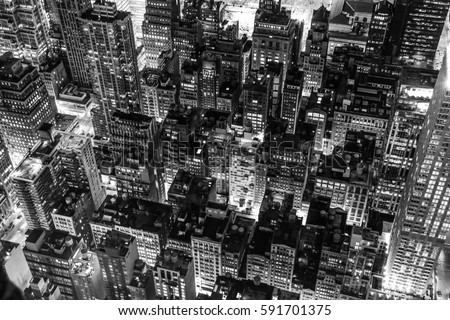 Black and white New York city night scene from Empire State Building.