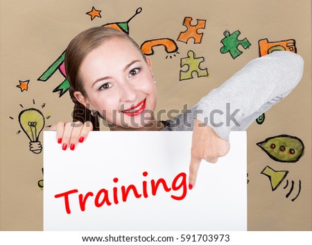Young woman holding whiteboard with writing word: training. Technology, internet, business and marketing.