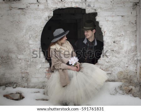 Happy couple in love on a date in the ruins old factory. Vintage style.