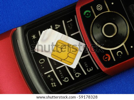 Cellular phone with a SIM card isolated on blue concepts of wireless communication