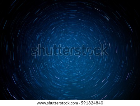 Direct view of the North Star. Star trails looks like colorful well. Blue dominates the picture