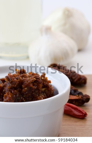 Close-up image of tomato pesto made from dried tomatoes, chillies, parmesan cheese, garlic and pine nuts
