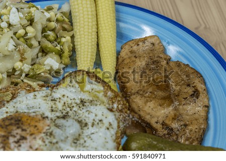 Chicken meat with potatoes and egg and vinegar vegetable
