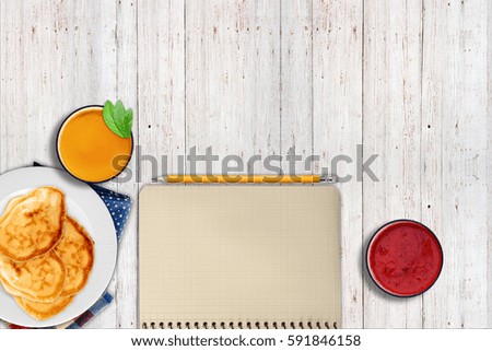 Notepad, pancakes orange juice